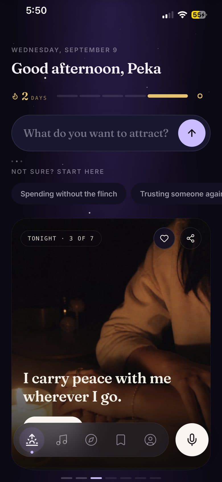 The Today screen at night: a warm greeting, a streak, a box asking what you want to attract, and tonight's affirmation over a photograph.